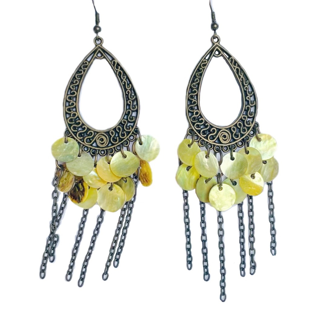 Beautiful bohemian style dangling drop earrings with seashell and chain details